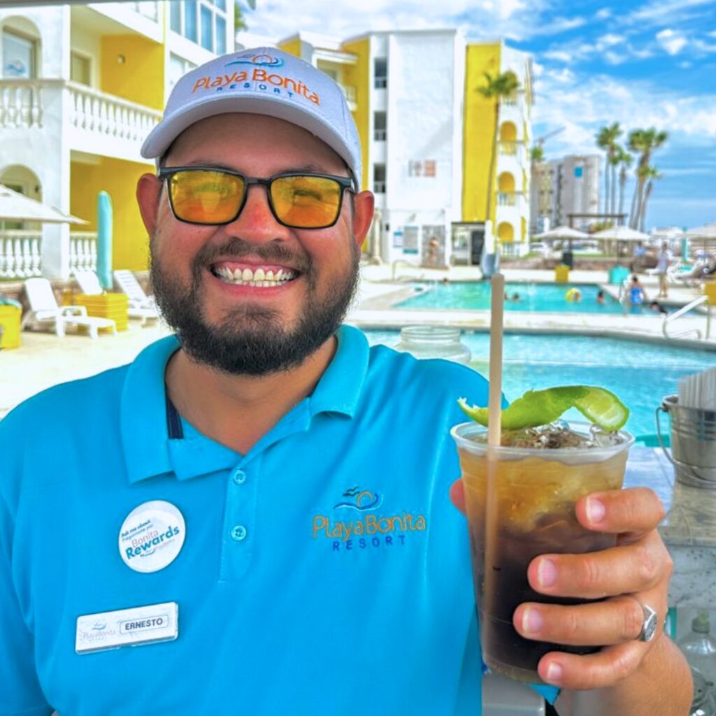 Bartender serving a cocktail at the pool bar of Playa Bonita Resort in Rocky Point