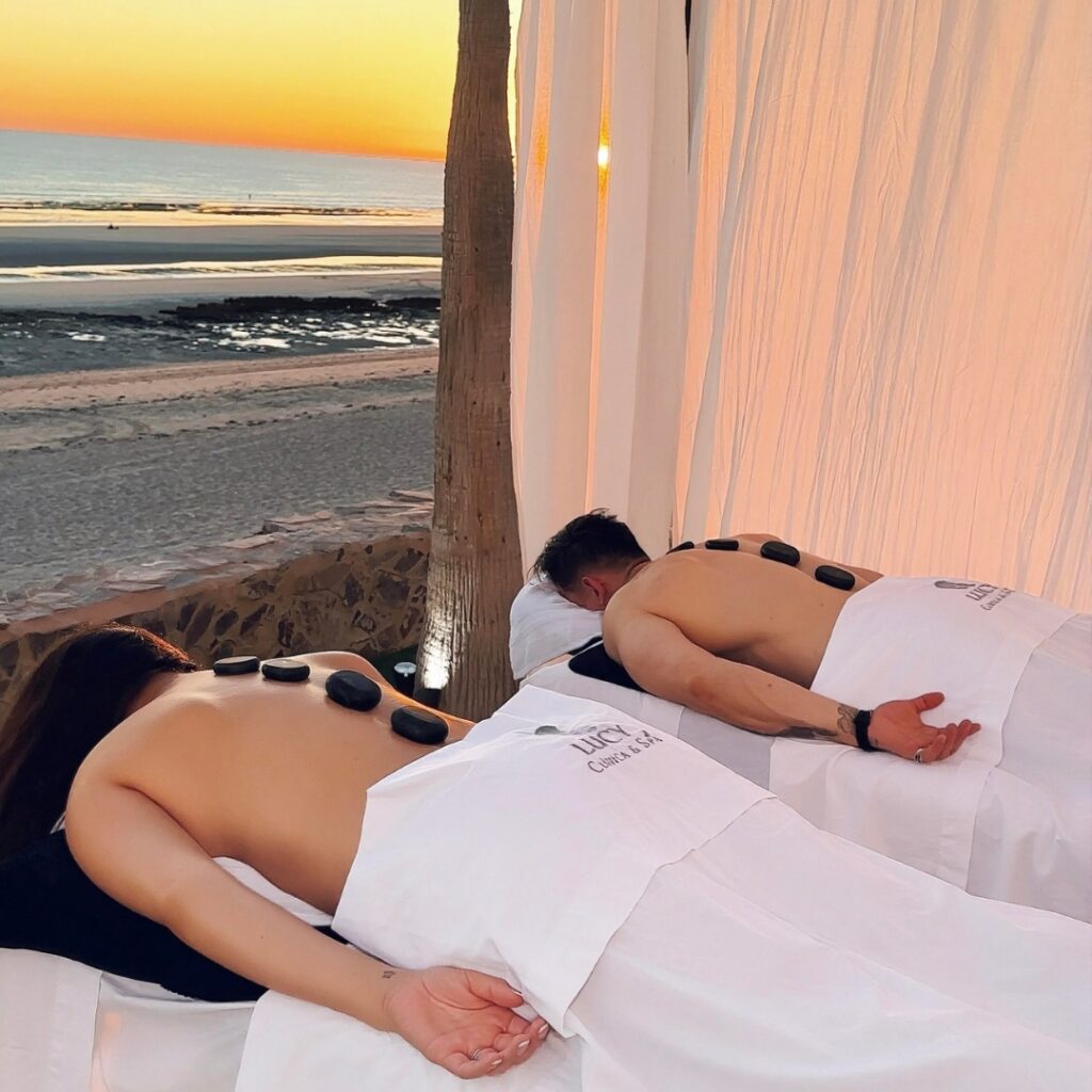 Couple enjoying an oceanfront spa massage at sunset in Rocky Point, Mexico