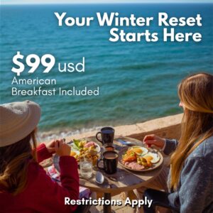 Couple enjoying drinks by the ocean at Playa Bonita Hotel Resort in Rocky Point during a winter beachfront stay